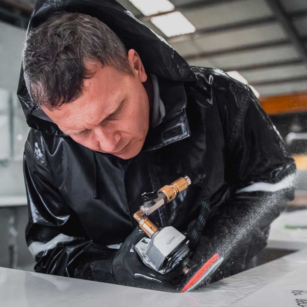 Granite slab being precision-cut at Elliott Stone Works’ workshop in Cranleigh, Surrey