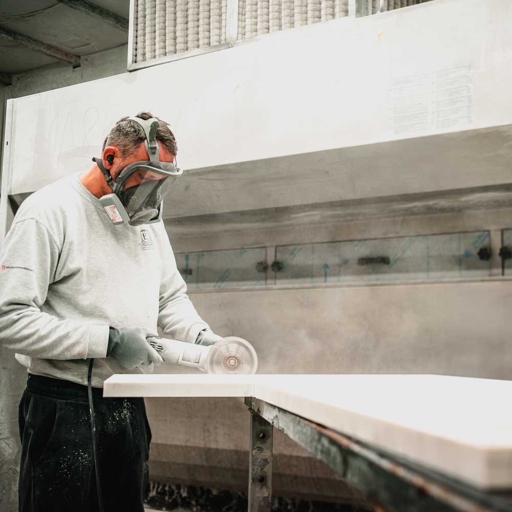 Granite slab being precision-cut at Elliott Stone Works’ workshop in Cranleigh, Surrey