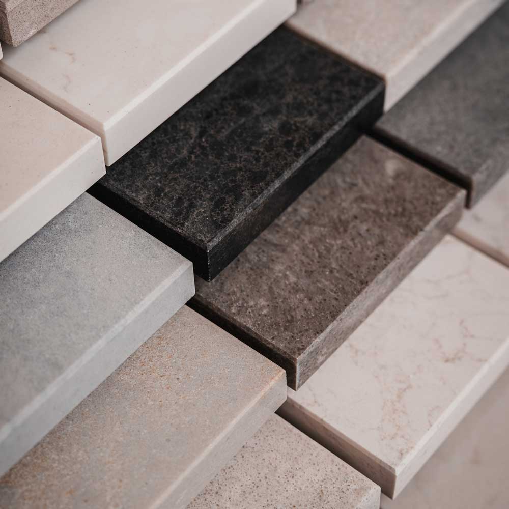 Stone kitchen work surface material options including quartz, granite, marble and porcelain, by Elliott Stone Works in Surrey